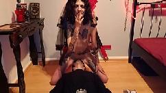Licking blasphemic whore while she smokes and rides a crucifix dildo